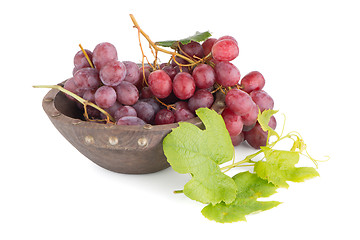 Image showing Fresh red grapes in wood bown