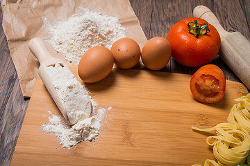 Image showing Raw pasta, tomato and eggs