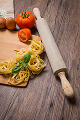 Image showing Raw pasta, tomato and eggs