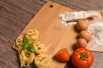 Image showing Raw pasta, tomato and eggs