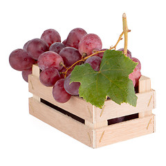 Image showing Red grapes in wooden crate