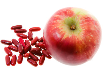 Image showing Red Apple and   pill 