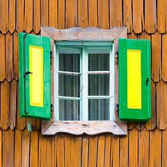 Image showing Colorful vintage wooden window shutters.