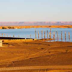 Image showing sunshine in the lake yellow  desert of morocco sand and     dune