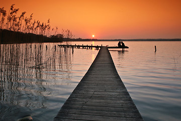 Image showing Lake in denmark with a jetty in winter shot with colour graduate