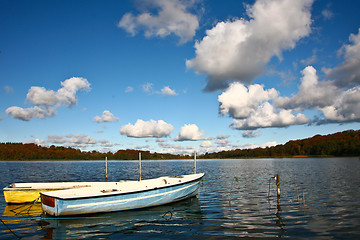 Image showing Colorful boats on a lake with cloudy blue sky in Denmark