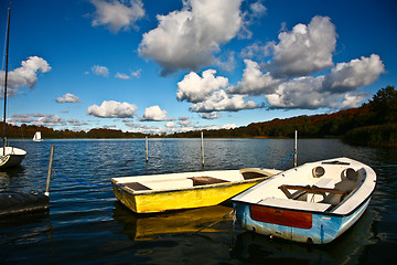 Image showing Colorful boats on a lake with cloudy blue sky in Denmark