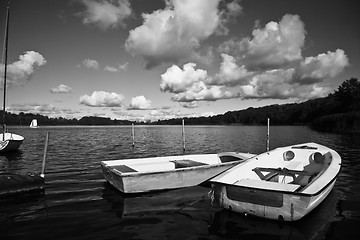 Image showing Colorful boats on a lake with cloudy blue sky in Denmark