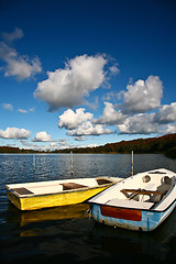 Image showing Colorful boats on a lake with cloudy blue sky in Denmark