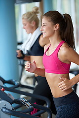 Image showing woman exercising on treadmill in gym