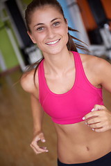 Image showing woman exercising on treadmill in gym