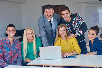 Image showing group of students getting suppport from teacher