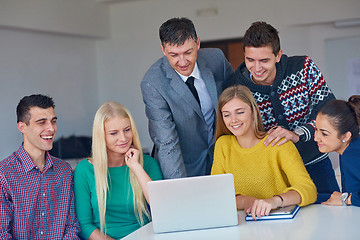 Image showing group of students getting suppport from teacher