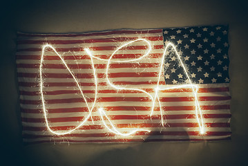 Image showing weathered American flag with word USA written on it