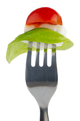 Image showing Caprese salad on the fork