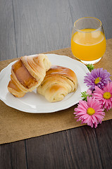 Image showing Croissants with orange juice