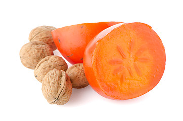 Image showing Ripe persimmons and nuts