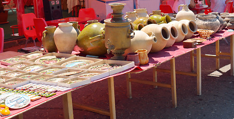 Image showing Clay plates, pots and samovars for sale