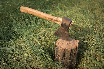 Image showing Firewood and old axe