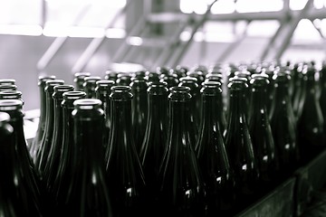 Image showing Many bottles on conveyor belt