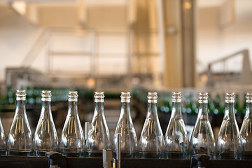 Image showing Many bottles on conveyor belt