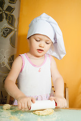 Image showing baby girl in cook role