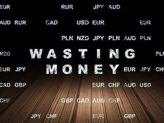 Image showing Banking concept: Wasting Money in grunge dark room