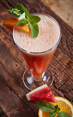 Image showing glass watermelon and orange smoothie