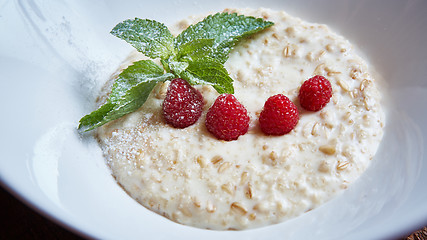 Image showing oatmeal with raspberries