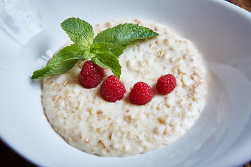Image showing oatmeal with raspberries