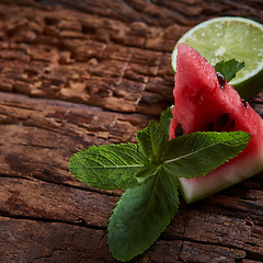 Image showing Watermelon, mint and lime on the wooden background