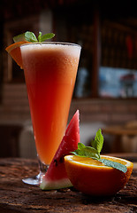 Image showing glass watermelon and orange smoothie