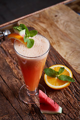 Image showing glass watermelon and orange smoothie