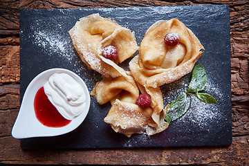 Image showing Crepes with raspberries