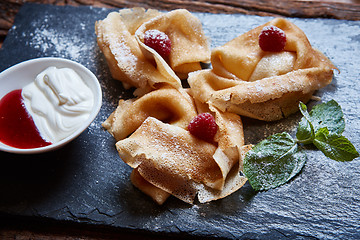 Image showing Crepes with raspberries