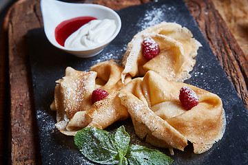 Image showing Crepes with raspberries