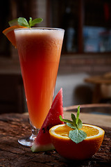 Image showing glass watermelon and orange smoothie