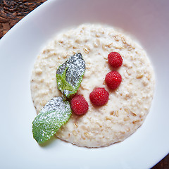 Image showing oatmeal with raspberries