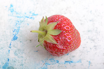 Image showing Close up of strawberry with green leaves
