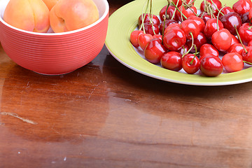 Image showing Fresh berries background: apricots, cherries, raspberry, strawberry