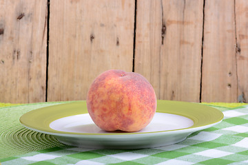 Image showing fresh peaches on green plate, food concept