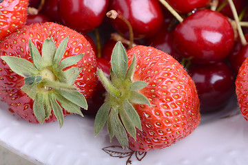 Image showing Background from fresh ripe strawberries and cherry