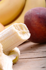 Image showing fruits on table, apple, bananas, peach close up, health food concept