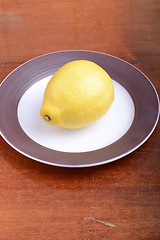 Image showing fresh lemon on grey plate