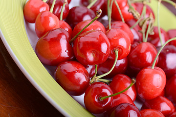 Image showing Cherries on green table close up 