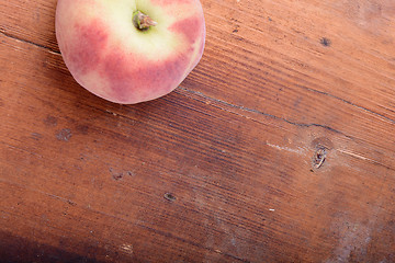 Image showing Peach on wooden plate