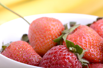 Image showing healthy strawberry smoothie with fruits on wooden background