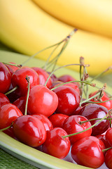 Image showing Close up of a fresh pile of fruit consisting of cherries and bananas