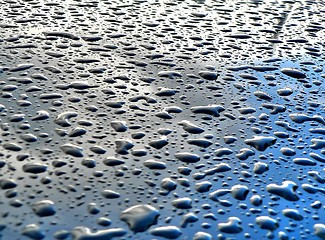 Image showing rain drops on metallic surface