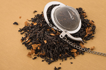 Image showing Black dry tea with petals